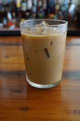 Glass of Iced Coffee with Milk on a Restaurant Bar