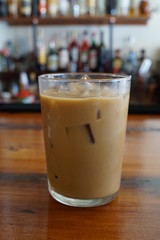 Glass of Iced Coffee with Milk on a Restaurant Bar