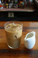 Glass of Iced Coffee with Milk on a Restaurant Bar