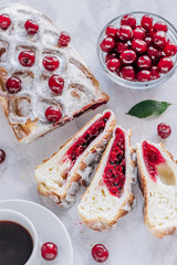 Cherry strudel on a marble background. Top view.
