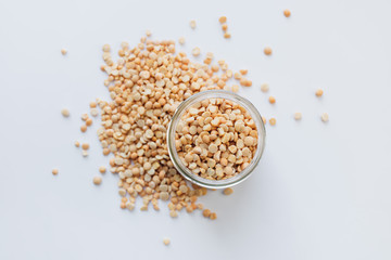 Glass jar with raw dry peas, macro