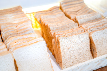 bread square slide in large white square bowl at Thailand resort.