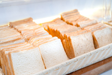 bread square slide in large white square bowl at Thailand resort.