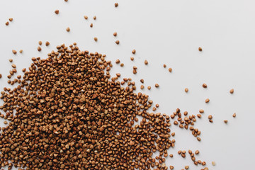 Raw buckwheat on white background