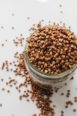 Raw buckwheat on white background