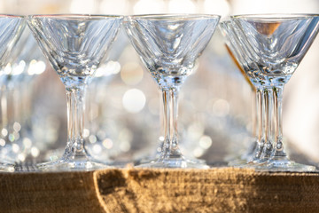 close up arranged glass on the table in abstract field in celebration time for any luxury background.