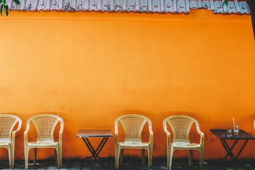 Outdoor cafe with chairs and table on the pavement in Ho Chi MInh city, Vietnam