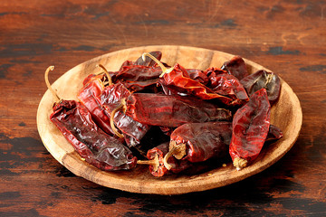 Dry hot pepper on wooden background