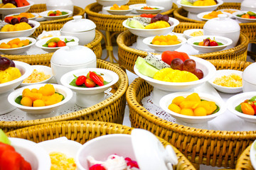 Thai tranditional desserts set including Thai dessert, fruit, ice dessert on Khantoke (Local wicker step for eat)