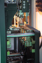 Process of plastic bottle on plastic Bottle blowing machine. Industrial manufacturing