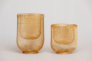 Metal mesh candlesticks of Golden color isolated on white background.
