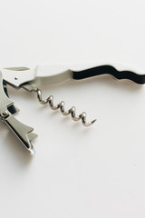 Metal corkscrew on white background