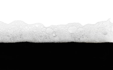Macro foam and dark beer bubbles isolated on white background and texture 