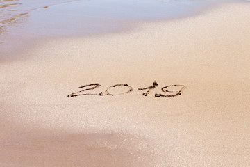 2019 text on the beach. Planning vacation.