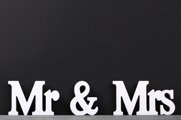 White letters Mr and Mrs on black background