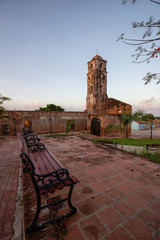 Fototapeta na wymiar Beautiful View of a Church in a small touristic Cuban Town during a vibrant sunny and cloudy sunrise. Taken in Trinidad, Cuba.