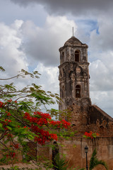 Fototapeta na wymiar Beautiful View of a Church in a small touristic Cuban Town during a vibrant sunny and cloudy day. Taken in Trinidad, Cuba.