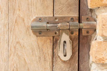 Old door bolts on wooden doors
