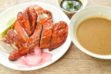 roasted duck meat and pickled ginger dipping sweet soy sauce on plate