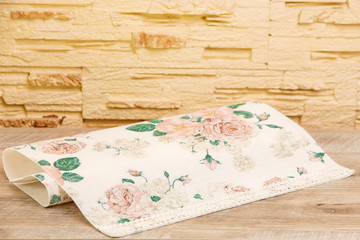  Tablecloth with flowers on a wooden table