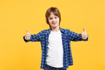 Fun cheerful happy little kid boy in blue shirt white t-shirt posing gesturing hands isolated on yellow wall background children studio portrait. People childhood lifestyle concept. Mock up copy space