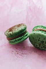 Composition of delicious macaroons on pink background