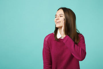 Fototapeta premium Young woman girl casual clothes posing isolated on blue green turquoise wall background studio portrait. People sincere emotions lifestyle concept. Mock up copy space. scream with hand near mouth