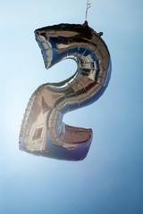 number 2 helium filled balloon against a blue sky