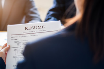 Interviewer reading a resume, Person submits job application, Person describe yourself to interviewer, Close up view of job interview in office, recruiter considering application, hr manager making hi