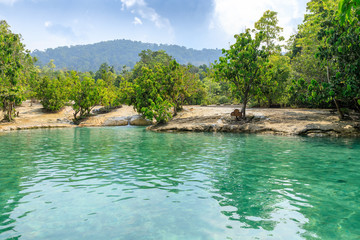Beautiful crystal clear Emerald Pool, famous natural swimming place and tourist destination in the Krabi, Thailand.