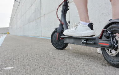 Teenage girl circulating with an electric scooter © expressiovisual