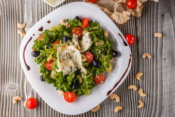 salad provence with blue cheese on wooden table