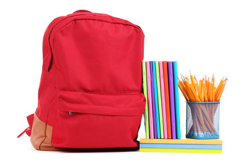 Backpack with notepads and pencils isolated on white background