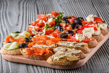 Assorted bruschetta Set of various appetizing snacks sandwiches