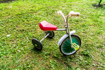 old children's tricycle bike. Retro three-wheeled bicycle of the 80s