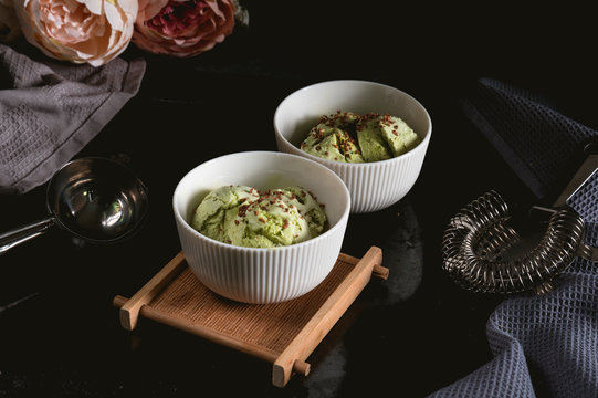 Homemade matcha green tea ice cream on dark background