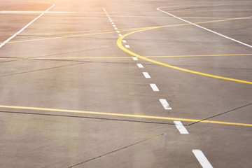 Marking for ground transportation on the airport apron among taxiways.