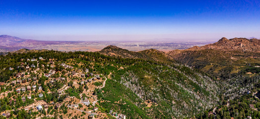 Aerial, panoramic, drone view of the high desert near Apple Valley and Hesperia from the San Bernarindo Mountains near Lake Arrowhead, California
