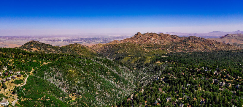 Aerial, panoramic, drone view of the high desert near Apple Valley and Hesperia from the San Bernarindo Mountains near Lake Arrowhead, California
