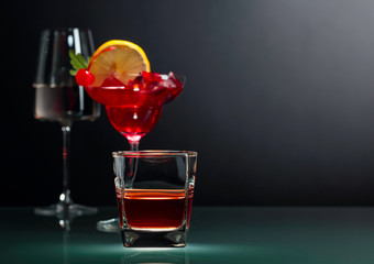 Various alcoholic drinks on a black background.
