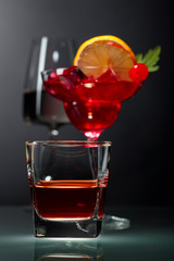 Various alcoholic drinks on a black background.