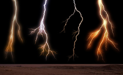 Lightnings striking towards the ground. Lightnings during a thunderstorm on a sunset
