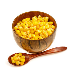 Corn seeds in a wooden spoon and cup (plate) isolated on white background