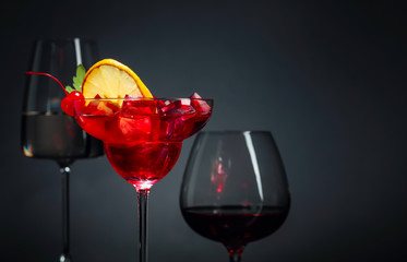 Various alcoholic drinks on a black background.