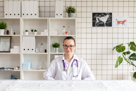 Portrait of a veterinarian in the office of the clinic for the clinic. Soft focus.