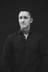 Business man in black shirt portrait