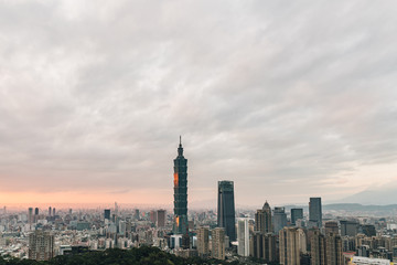 Fototapeta na wymiar Aerial over Downtown Taipei with Taipei 101 Skyscraper in the dusk from Xiangshan Elephant Mountain in the evening.