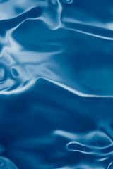 . Blue liquid shiny background.