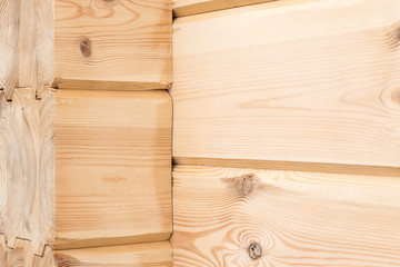 Wood Glued timber close up background. Wooden construction glued laminated timber in the wall of the house. Glued beams. Wooden beams in the groove