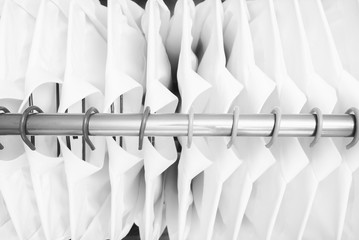 Row of cloth hanger with shirts